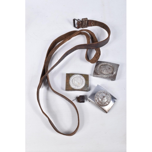 432 - THREE GERMAN BELT BUCKLES AND A LEATHER BELT, the buckles include on with a centre shield with a wre... 