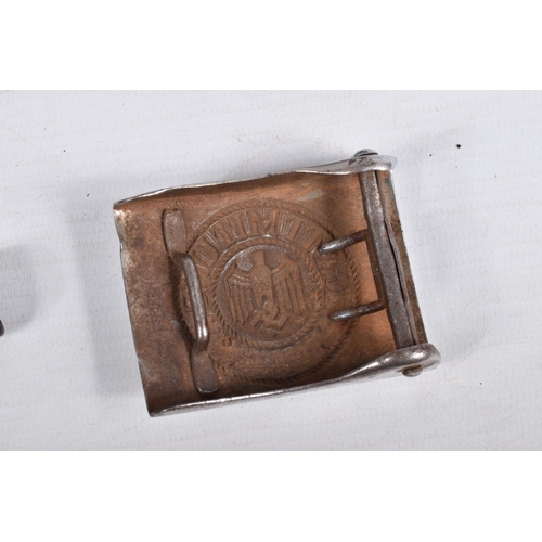 432 - THREE GERMAN BELT BUCKLES AND A LEATHER BELT, the buckles include on with a centre shield with a wre... 