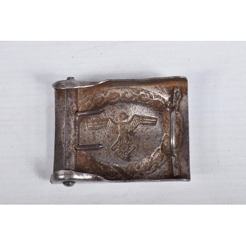 432 - THREE GERMAN BELT BUCKLES AND A LEATHER BELT, the buckles include on with a centre shield with a wre... 