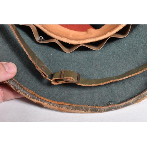 458 - A 1942 DATED GERMAN ARIKACORPS PITH HELMET WITH DECALS, this is the olive green tropical sun hat wit... 