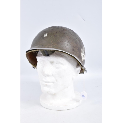 461 - A USA ARMY STEEL HELMET, this is khaki green in colour and traces of black are coming through the pa... 