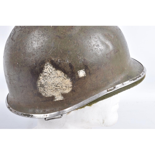 461 - A USA ARMY STEEL HELMET, this is khaki green in colour and traces of black are coming through the pa... 