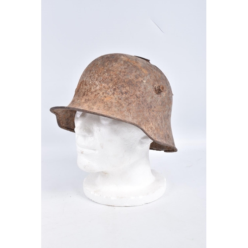 462 - A WWI ERA GERMAN BATTLE DAMAGED HELMET, this has damage to the top in two places and has some light ... 