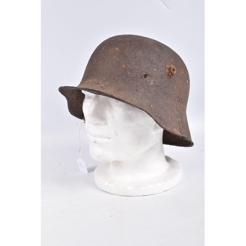 463 - A WW1 ERA GERMAN HELMET RELIC WITH BATTLE DAMAGE, this is  just the shell and there is damage to the... 