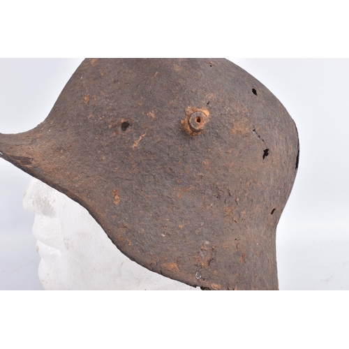 463 - A WW1 ERA GERMAN HELMET RELIC WITH BATTLE DAMAGE, this is  just the shell and there is damage to the... 