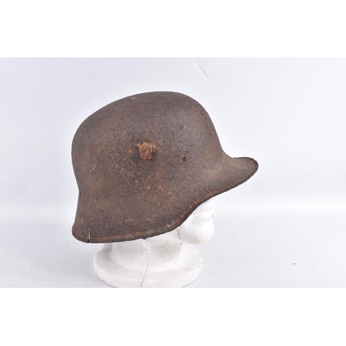 463 - A WW1 ERA GERMAN HELMET RELIC WITH BATTLE DAMAGE, this is  just the shell and there is damage to the... 