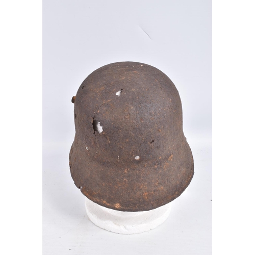 463 - A WW1 ERA GERMAN HELMET RELIC WITH BATTLE DAMAGE, this is  just the shell and there is damage to the... 