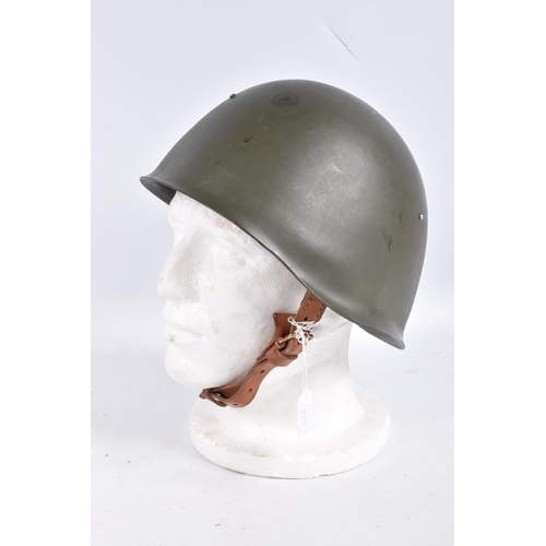 464 - A RUSSIAN COLD WAR ERA STEEL HELMET, it is green in colour and features a red star on the front, the... 