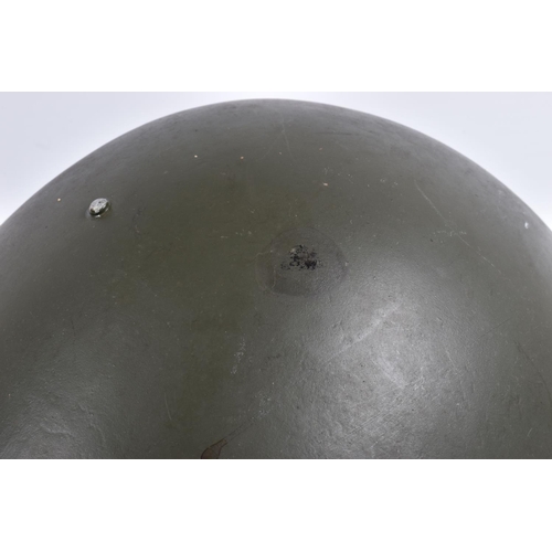 464 - A RUSSIAN COLD WAR ERA STEEL HELMET, it is green in colour and features a red star on the front, the... 