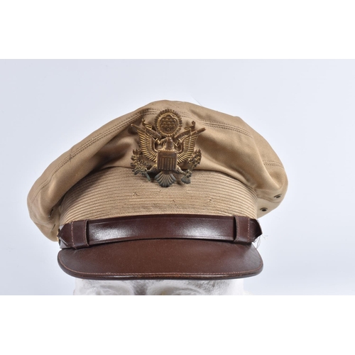 466 - A UNITED STATES OF AMERICA TROPICAL  PEAKED CAP, this is beige and brown with the USA insignia on th... 