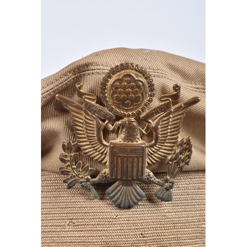 466 - A UNITED STATES OF AMERICA TROPICAL  PEAKED CAP, this is beige and brown with the USA insignia on th... 