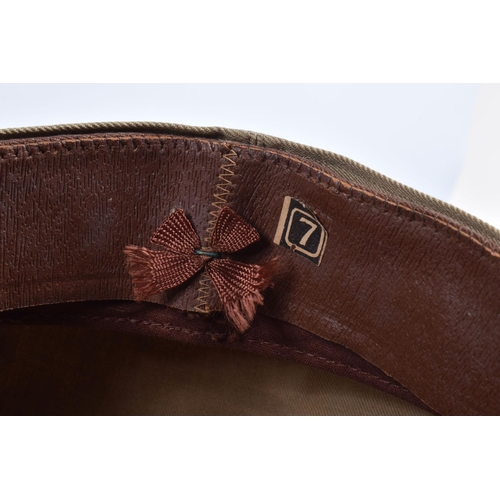 466 - A UNITED STATES OF AMERICA TROPICAL  PEAKED CAP, this is beige and brown with the USA insignia on th... 