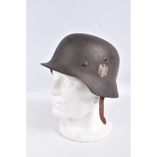 468 - A WWII ERA GERMAN STEEL HELMET WITH DOUBLE DECALS, we believe this to be an M35 helmet, it is comple... 