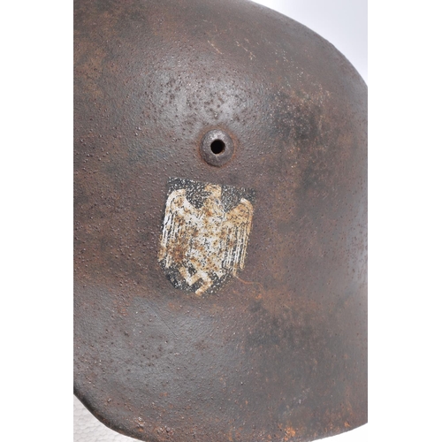 468 - A WWII ERA GERMAN STEEL HELMET WITH DOUBLE DECALS, we believe this to be an M35 helmet, it is comple... 