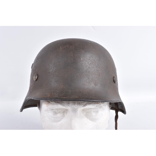 468 - A WWII ERA GERMAN STEEL HELMET WITH DOUBLE DECALS, we believe this to be an M35 helmet, it is comple... 