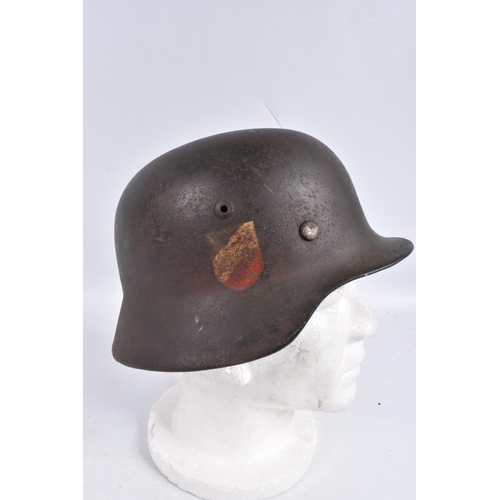 468 - A WWII ERA GERMAN STEEL HELMET WITH DOUBLE DECALS, we believe this to be an M35 helmet, it is comple... 