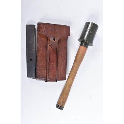 471 - A LEATHER POUCH CONTAINING THREE EMPTY MP34 MACHINE GUN BULLET CLIPS, a replica German stick grenade... 