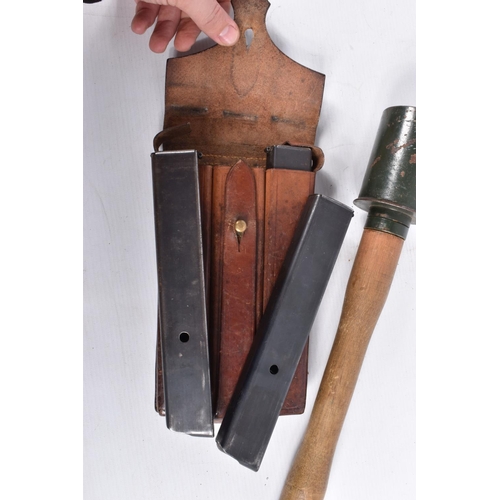 471 - A LEATHER POUCH CONTAINING THREE EMPTY MP34 MACHINE GUN BULLET CLIPS, a replica German stick grenade... 