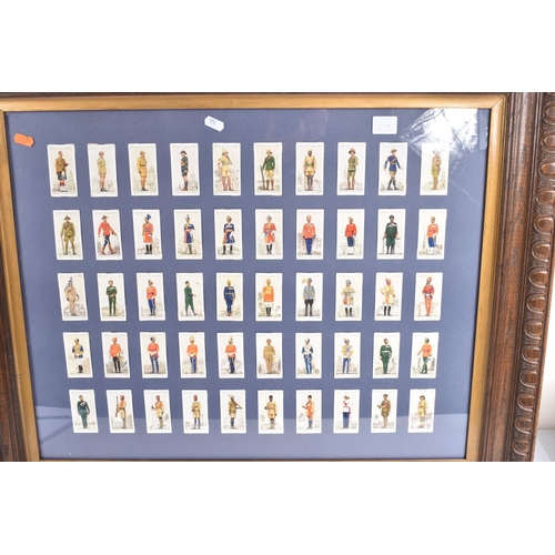 472 - THREE FRAMED AND GLAZED DISPLAYS OF CIGARETTE CARDS FEATURING BRITISH ARMY UNIFORMS AND HEADDRESS, t... 