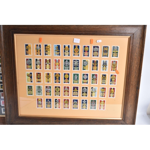 473 - THREE FRAMED AND GLAZED DISPLAYS OF MILITARY CAP BADGES AND KINGS COLOURES, the cards include one fr... 