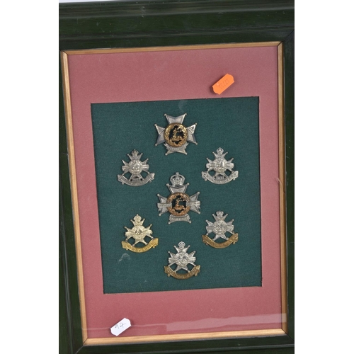 475 - SEVEN FRAMED AND GLAZED DISPLAY OF MILITARY CAP BADGES, they cover different eras of the twentieth c... 