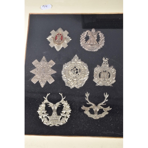 475 - SEVEN FRAMED AND GLAZED DISPLAY OF MILITARY CAP BADGES, they cover different eras of the twentieth c... 