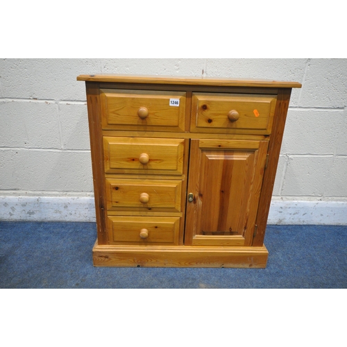 1246 - A MODERN PINE CABINET, with five drawers and a single cupboard door, width 71cm x depth 35cm x heigh... 