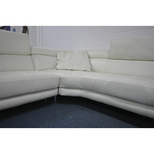 1297 - A WHITE LEATHER L SHAPED CORNER SOFA, with three adjustable head rests, on shaped metal legs, longes... 