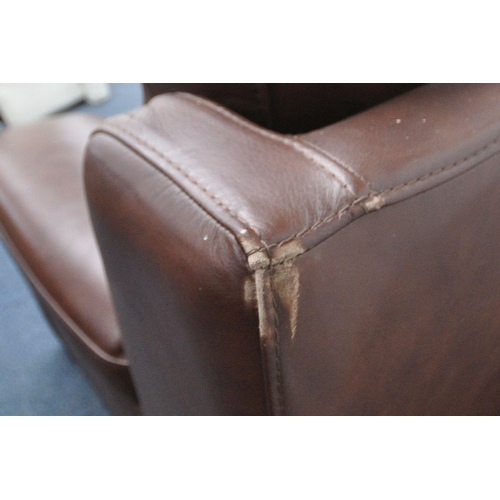 1303 - A BROWN LEATHER THREE SEATER SOFA, and an armchair (condition report: in need of a clean, other wear... 