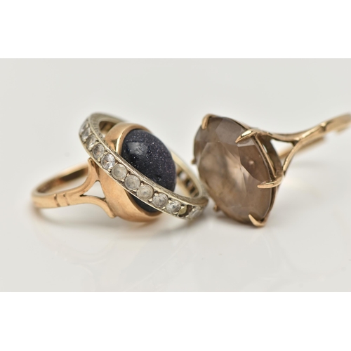 11 - THREE GEM SET RINGS, to include a blue goldstone cabochon ring, collet set to the bifurcated shoulde... 