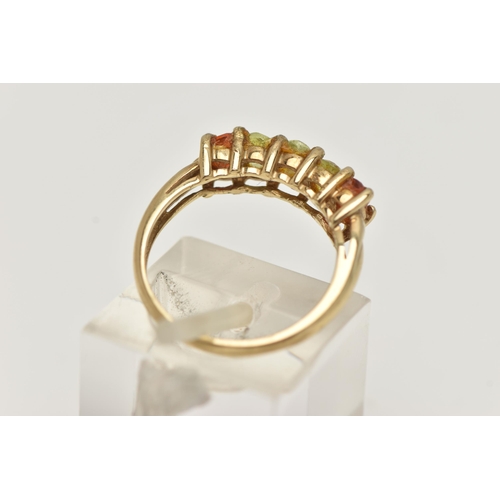 16 - A 9CT GOLD GEM SET RING, designed as a line of oval cut gems, the central three assessed as possibly... 