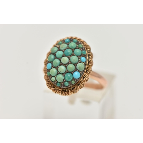 24 - A TURQUOISE RING, the oval panel set with circular turquoise cabochons, some replacements, to the ro... 