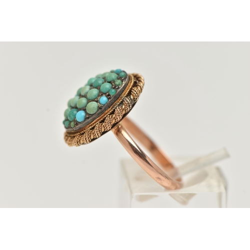 24 - A TURQUOISE RING, the oval panel set with circular turquoise cabochons, some replacements, to the ro... 