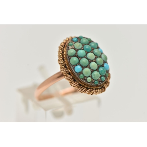 24 - A TURQUOISE RING, the oval panel set with circular turquoise cabochons, some replacements, to the ro... 