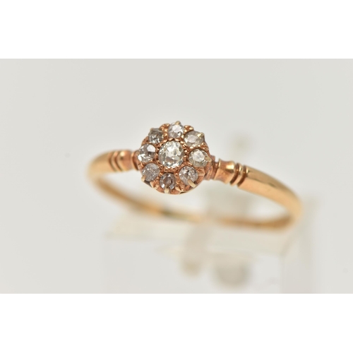 26 - AN EARLY 20TH CENTURY 18CT GOLD DIAMOND RING, designed as a central old cut diamond surrounded by ei... 