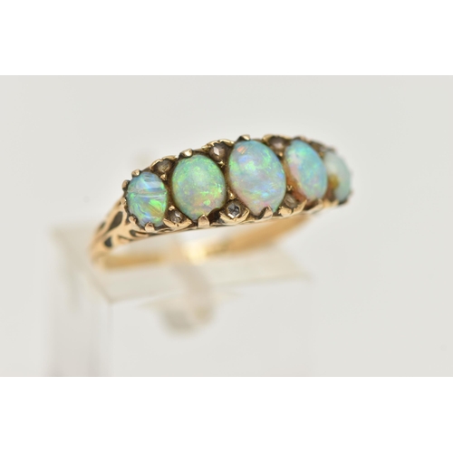 27 - A LATE VICTORIAN OPAL AND DIAMOND RING, designed as a line of five graduated oval opal cabochons int... 