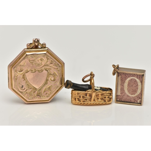 33 - TWO 9CT GOLD CHARMS AND A LOCKET, the first charm designed as a 9ct gold basket containing a wine bo... 