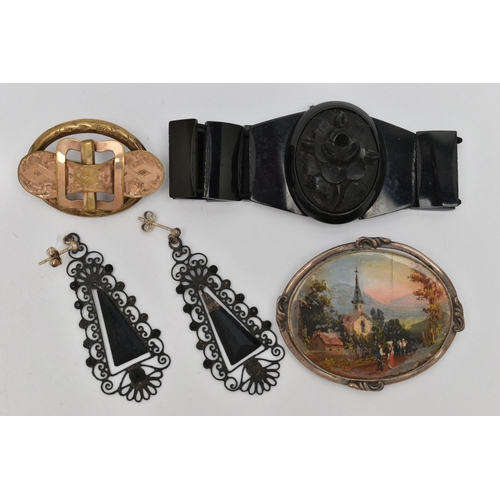 49 - A JET BRACELET, TWO BROOCHES AND A PAIR OF EARRINGS, the bracelet with a carved high relief jet came... 