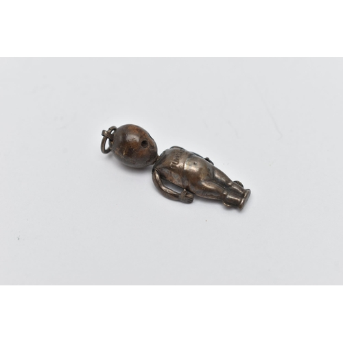 53 - A WHITE METAL FUMBSUP CHARM, an early 20th century WWI charm with kinetic arms, approximate length 3... 