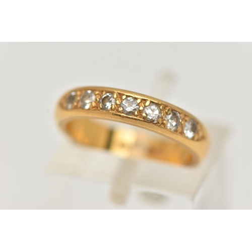 54 - A 22CT GOLD DIAMOND BAND RING, a combination of single cut and round brilliant diamonds, seven diamo... 