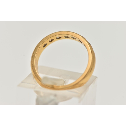 54 - A 22CT GOLD DIAMOND BAND RING, a combination of single cut and round brilliant diamonds, seven diamo... 