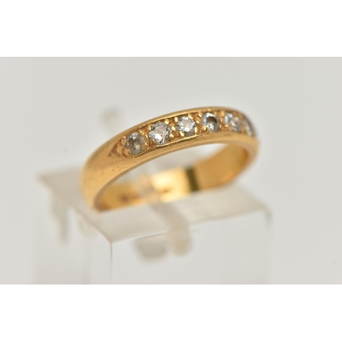 54 - A 22CT GOLD DIAMOND BAND RING, a combination of single cut and round brilliant diamonds, seven diamo... 