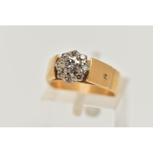 55 - A 22CT GOLD DIAMOND CLUSTER RING, a round brilliant cut diamond, set with a halo of eight single cut... 