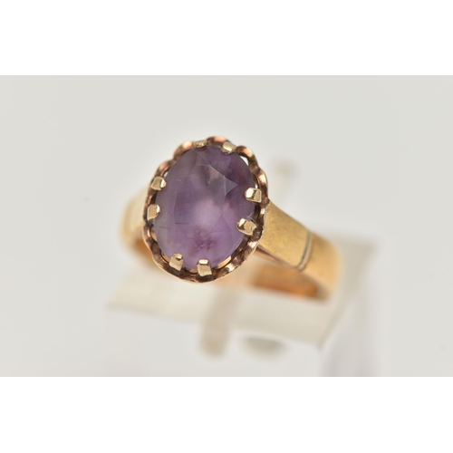 56 - A 22CT GOLD GEM SET RING, oval cut amethyst, prong set in yellow gold, hallmarked 22ct Birmingham, r... 