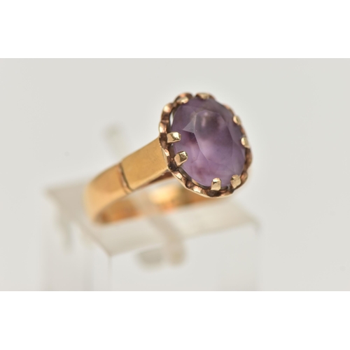 56 - A 22CT GOLD GEM SET RING, oval cut amethyst, prong set in yellow gold, hallmarked 22ct Birmingham, r... 