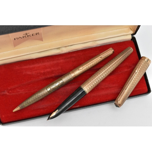 62 - A 9CT GOLD 'PARKER' FOUNTAIN PEN AND PENCIL, engine turned pattern, monogram engraving to the cartou... 