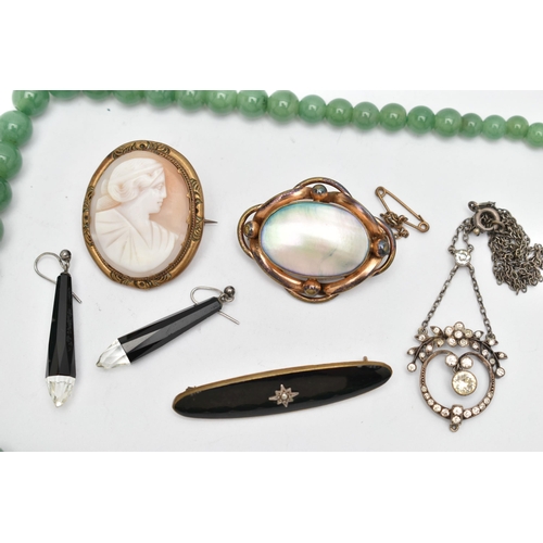 68 - A BAG OF ASSORTED JEWELLERY, to include a base metal carved shell cameo brooch, a shell and base met... 