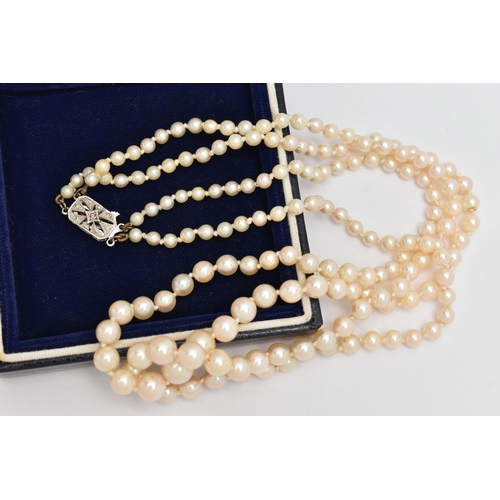 71 - A DOUBLE ROW CULTURED PEARL NECKLACE, double strand of graduated individually knotted cultured pearl... 