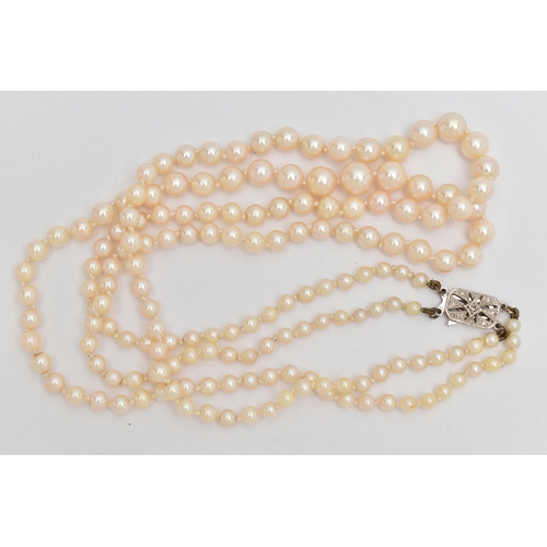 71 - A DOUBLE ROW CULTURED PEARL NECKLACE, double strand of graduated individually knotted cultured pearl... 