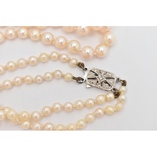 71 - A DOUBLE ROW CULTURED PEARL NECKLACE, double strand of graduated individually knotted cultured pearl... 